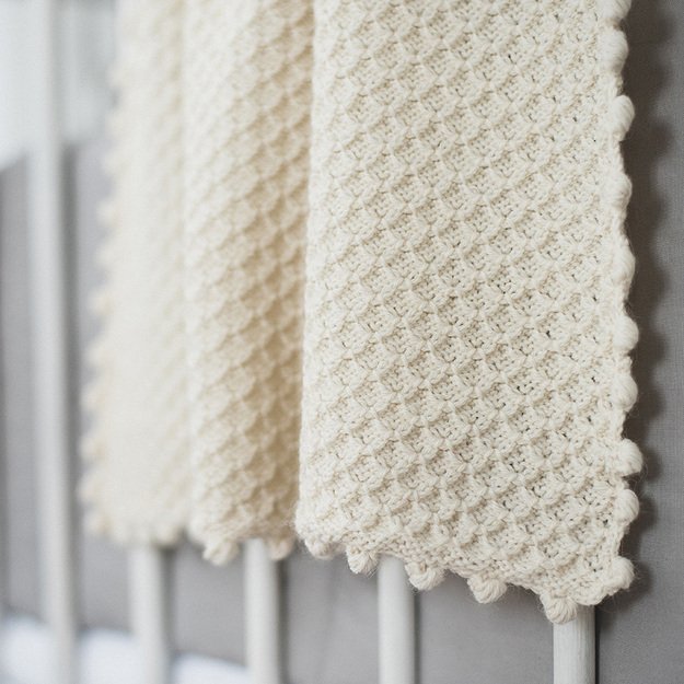 Natural beige soft knitted woolen blanket